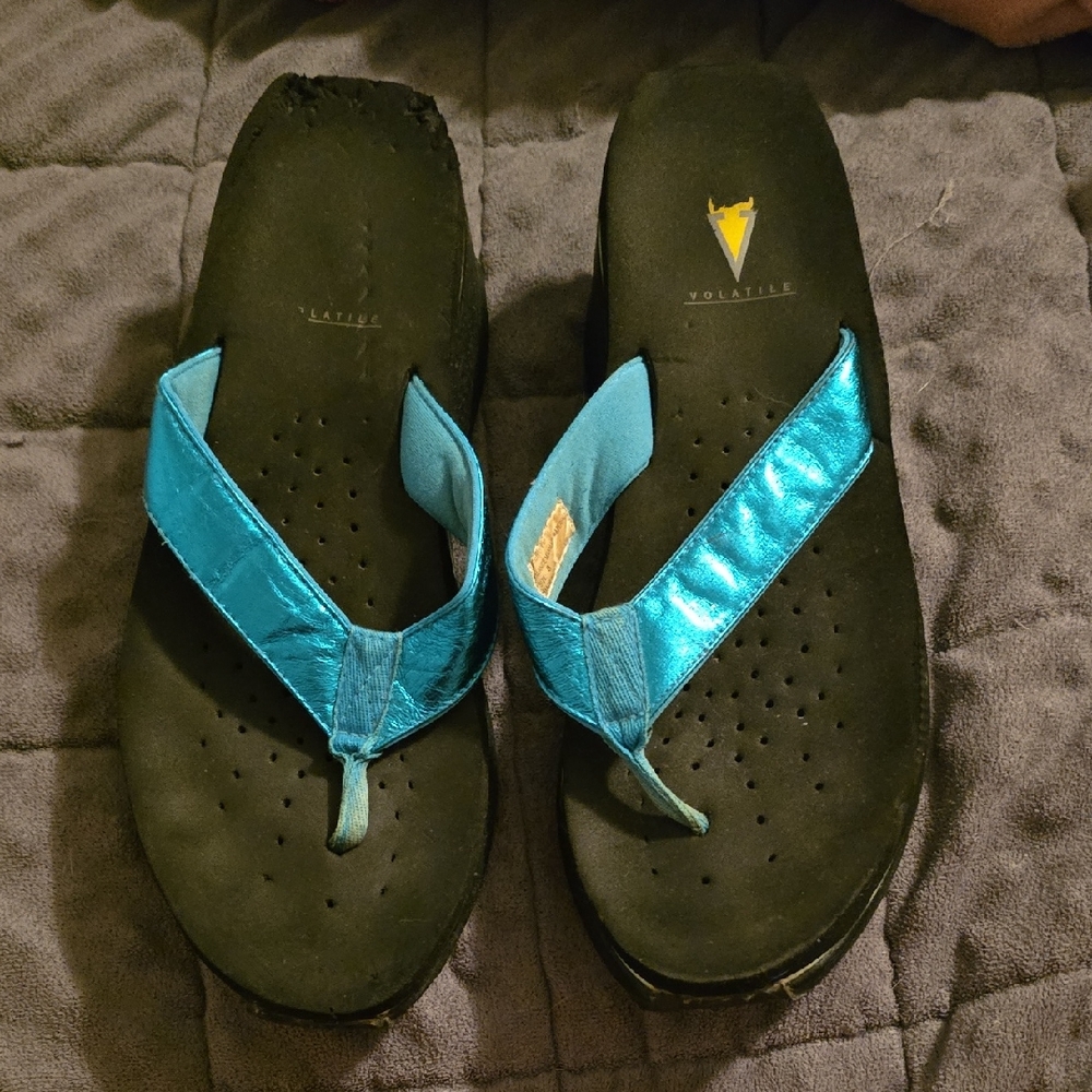 Volatile Turquoise and Black Flip-Flops
